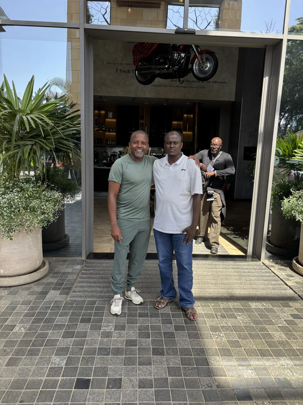 Paul of Paul Tours & Travel with a guest at a Nairobi establishment